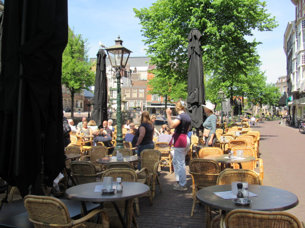 outdoor restaurant with many tables on sunny day