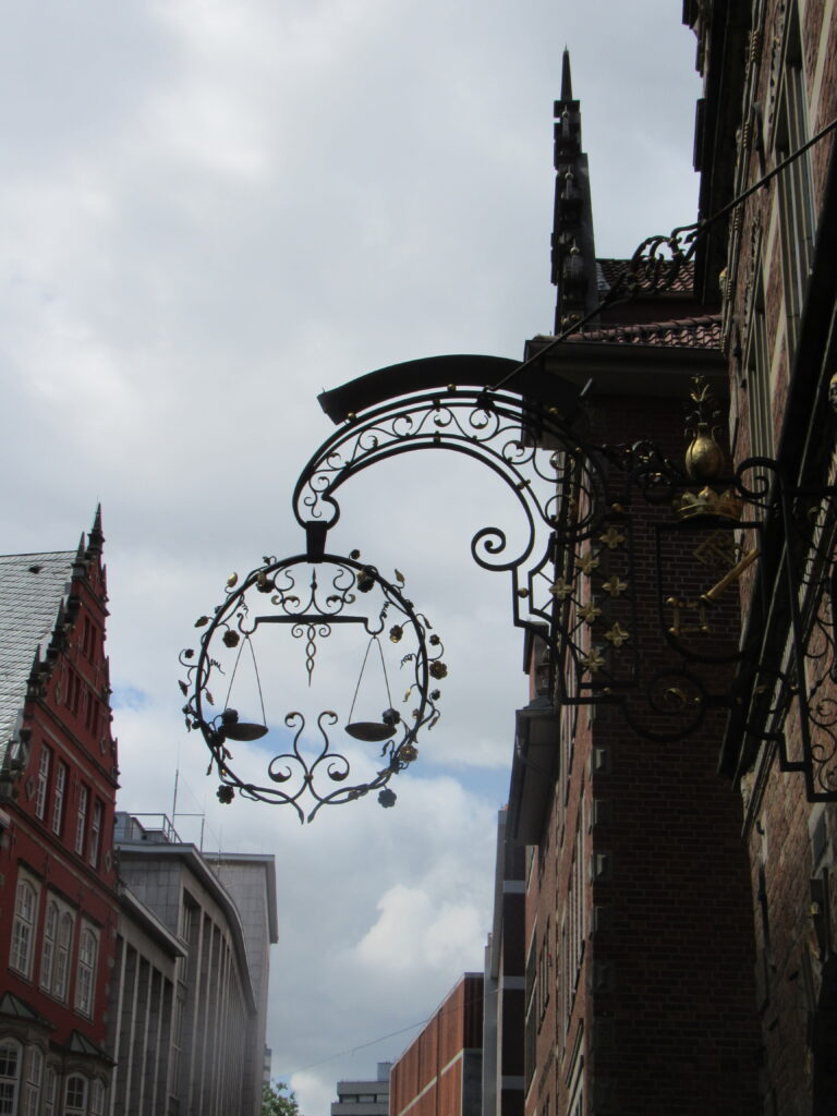 wrought iron hanging from front of building 