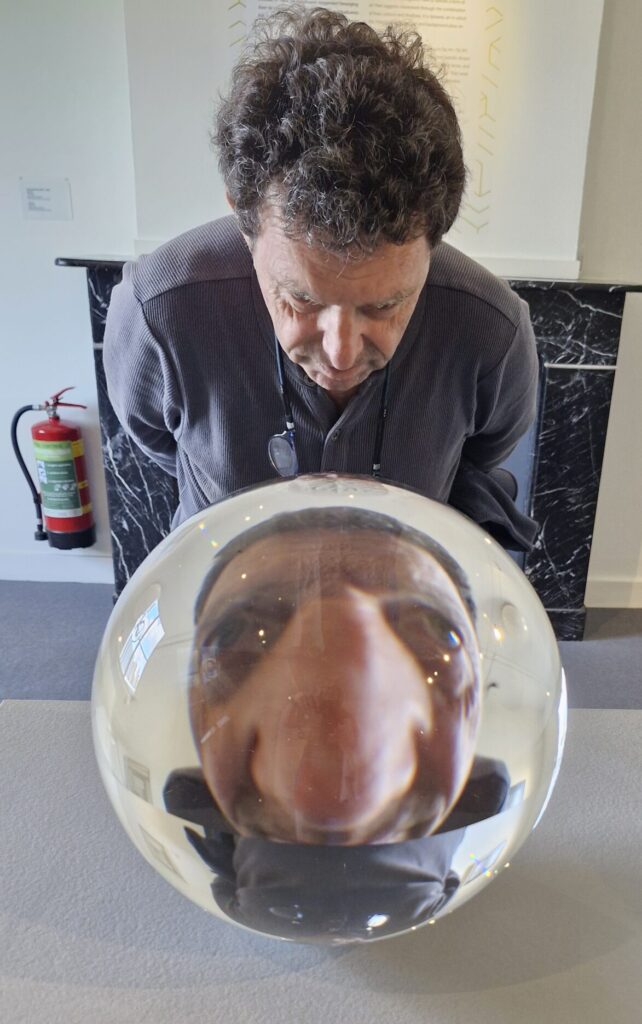 Many distorted by glass ball